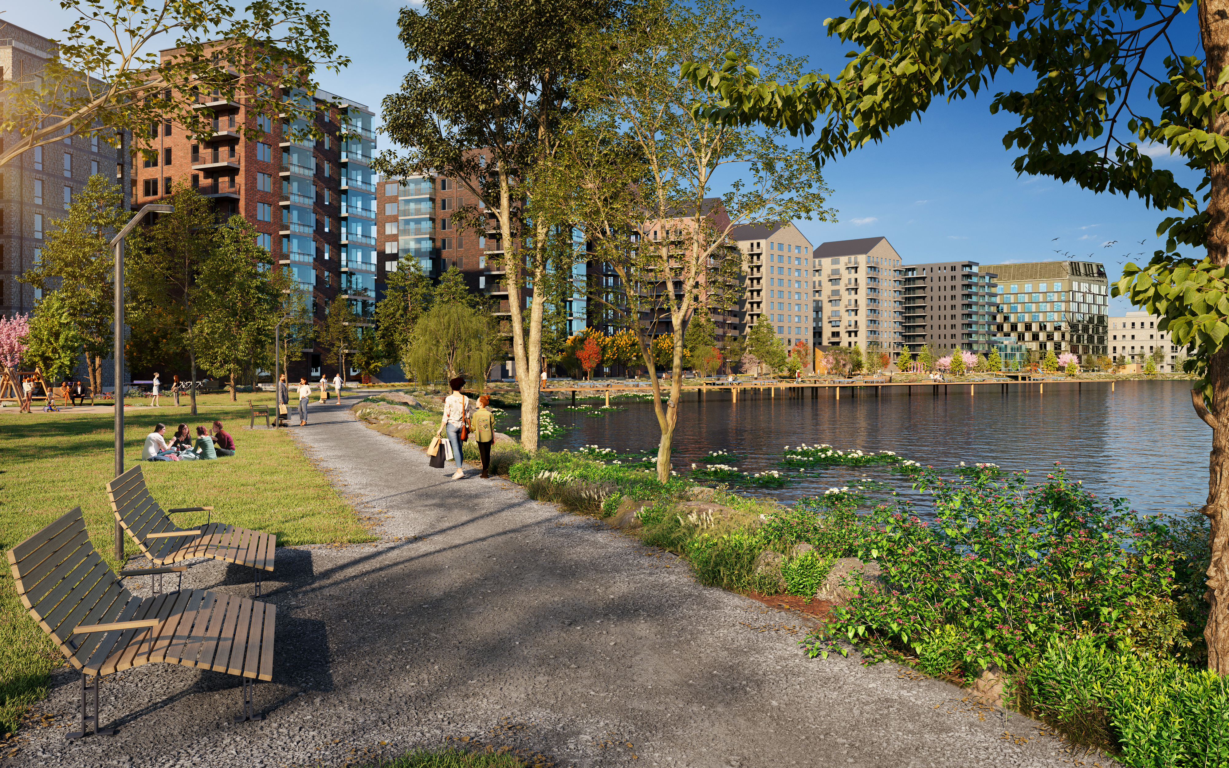 Visionsbild över Skeppsbroparken. Ett promenadstråk går längs vattnet. Människor sitter i gräset på filtar. Parken är full av träd och grönska. Ut i vattnet sträcker sig bryggor.